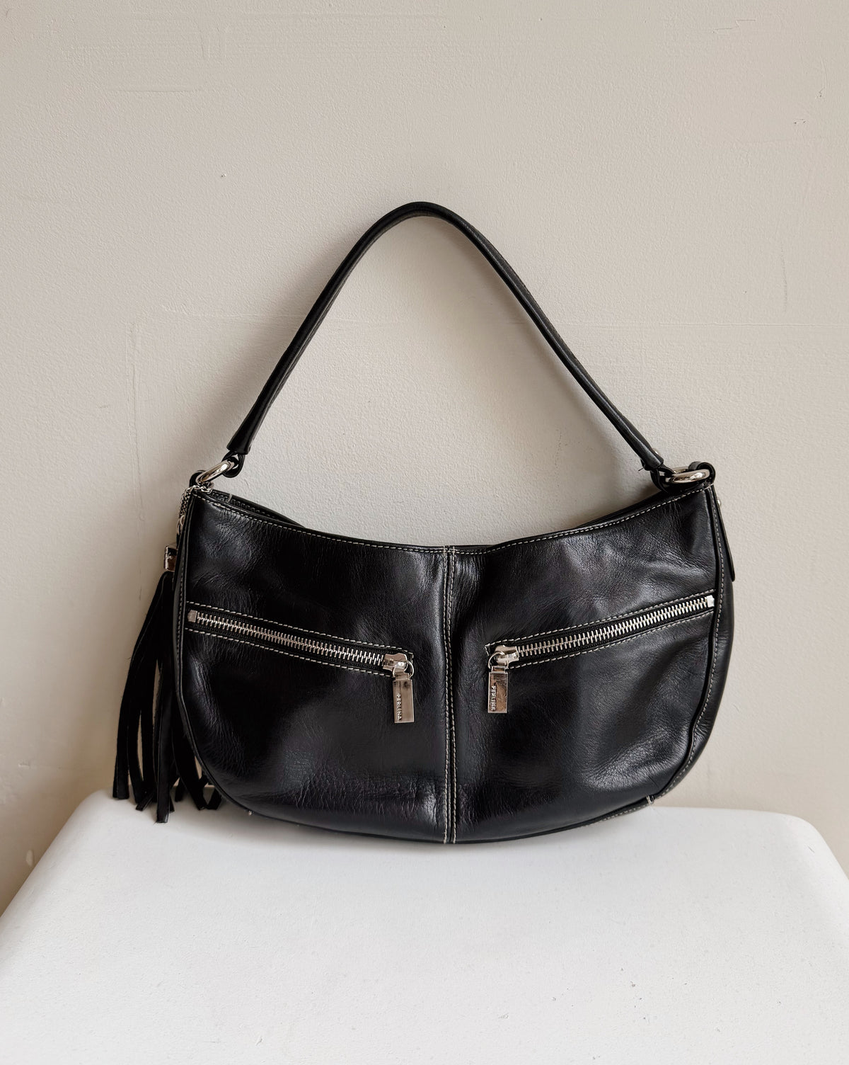 Raven Curved Leather Zip Shoulder Bag